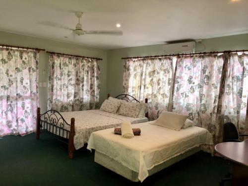 Ένα ή περισσότερα κρεβάτια σε δωμάτιο στο Leti's Homestay - Vaivase Uta