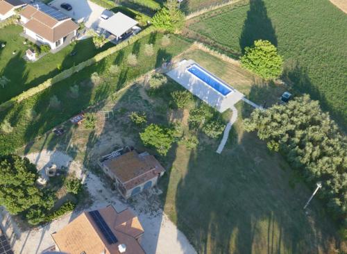 an aerial view of a house with a swimming pool at Il Granaio in Porto SantʼElpidio