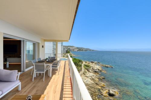 a view of the ocean from the balcony of a house at Ático Crucero Suite VIP in Roses