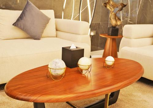 a living room with a coffee table and a couch at Farhan Tower in Juffair