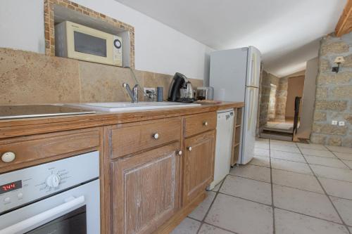 a kitchen with a sink and a counter top at L'incudine in Sartène