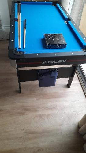 a ping pong table with a blue table top at Paul's Place in Longbridge