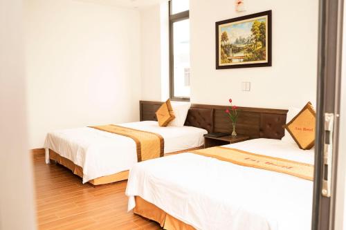 Ένα ή περισσότερα κρεβάτια σε δωμάτιο στο Lux Hotel FLC Sầm Sơn