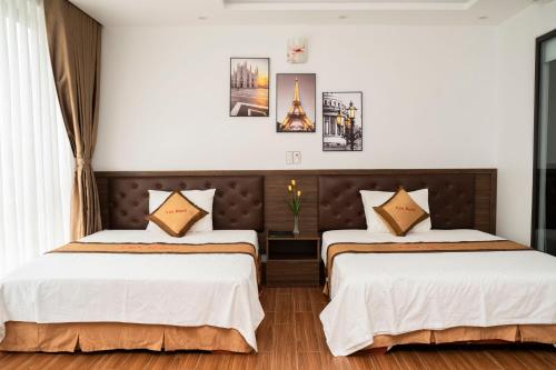 Ένα ή περισσότερα κρεβάτια σε δωμάτιο στο Lux Hotel FLC Sầm Sơn