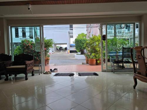 a room with a door open to a patio at Bella Bella Riverview in Bangkok