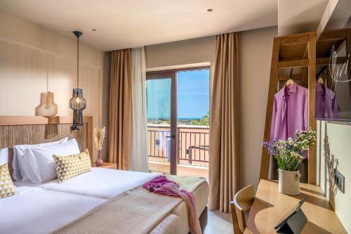 Ένα ή περισσότερα κρεβάτια σε δωμάτιο στο Hotel Pyriá