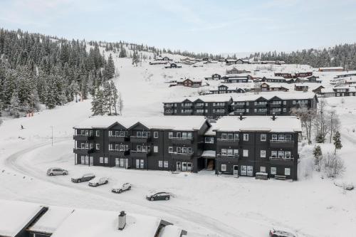 an aerial view of a resort in the snow at Voss Resort self-service apartments in Skulestadmo