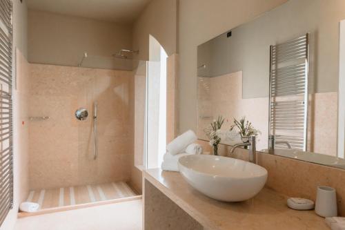 a bathroom with a large bowl sink and a shower at Classique in Lazise