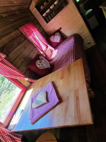 an overhead view of a table in a room at La roulotte rose rouge in Valgorge