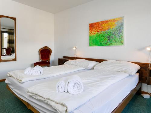 Ένα ή περισσότερα κρεβάτια σε δωμάτιο στο Apartment Residenza Chesa Margun 66-1 by Interhome