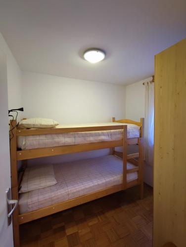 a bedroom with two bunk beds in a room at Apartma Mirko in Bovec