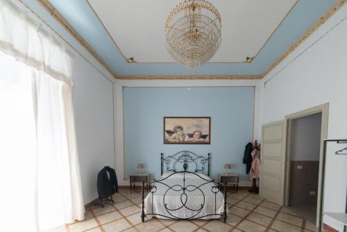 Letto o letti in una camera di Palazzo Marchese Milo