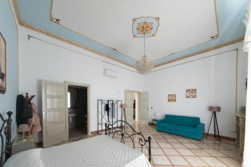 Letto o letti in una camera di Palazzo Marchese Milo
