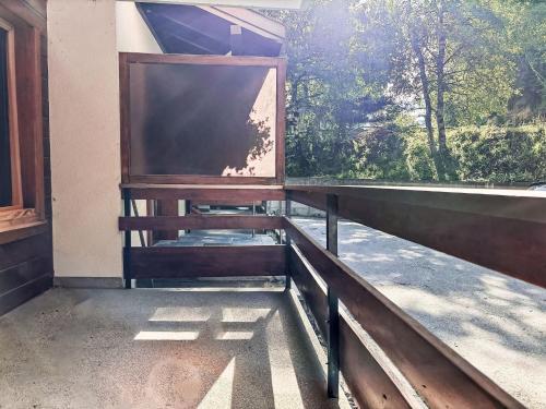 a large screen on a porch with a window at Apartment Derborence 28 by Interhome in Nendaz