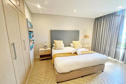 Katil atau katil-katil dalam bilik di First Group Breakers Resort - Official