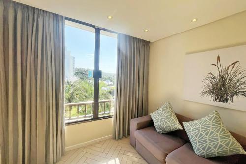 Ruang duduk di First Group Breakers Resort - Official