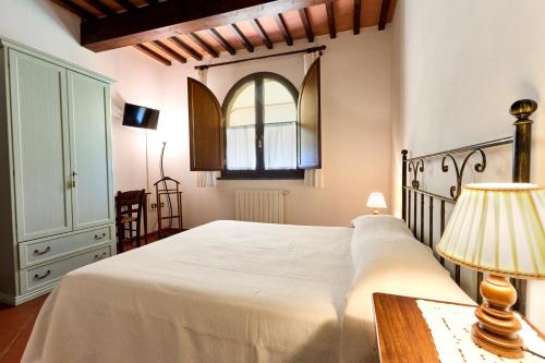 Postel nebo postele na pokoji v ubytování Collebrunacchi B&B