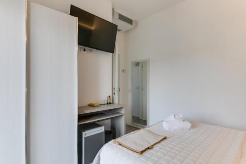 Letto o letti in una camera di MARITTIMO Milano Marittima