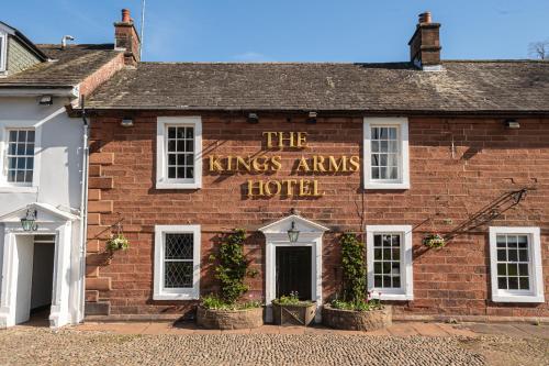 a brick building with a sign that reads the kings arms hotel at The Kings Arms Temple Sowerby in Temple Sowerby