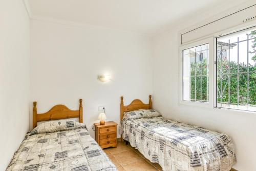 Ένα ή περισσότερα κρεβάτια σε δωμάτιο στο Villa Allegra