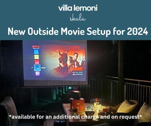 a tv screen with a movie movie setup on it at Villa Lemoni Skala - Heated Infinity Pool with Sea Views & Outside Cinema in Old Skala