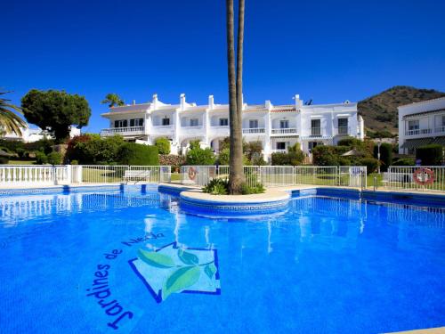 The swimming pool at or close to Holiday Home Jardines de Nerja by Interhome