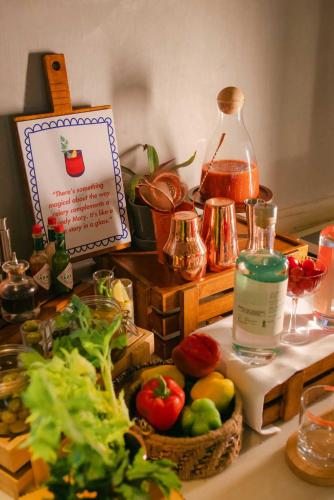 a counter with a bunch of food and a bottle of liquid at Hyatt Ronil Goa - a JdV by Hyatt Hotel in Calangute
