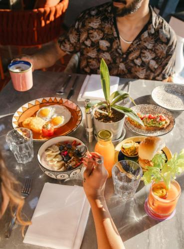 a table with a bunch of food on it at Hyatt Ronil Goa - a JdV by Hyatt Hotel in Calangute