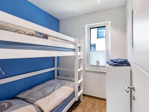 Katil atau katil-katil dalam bilik di Apartment Fischer sien Huus-4 by Interhome
