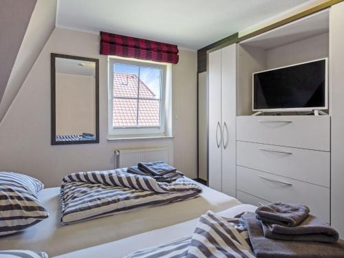 Katil atau katil-katil dalam bilik di Holiday Home MeerZeit I by Interhome
