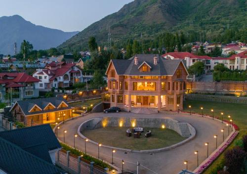 a large house with a large yard with lights at Lohono Stays Villa Noor in Srinagar