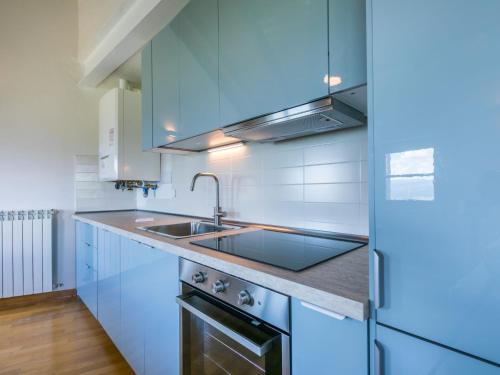 a kitchen with a sink and a stove at Apartment Casa del Sole by Interhome in Castelnuovo dellʼAbate