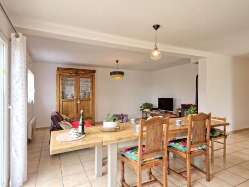 a dining room and living room with a table and chairs at Holiday Home Chez Lucie by Interhome in Camlez