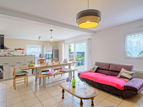 a living room with a couch and a table at Holiday Home Chez Lucie by Interhome in Camlez