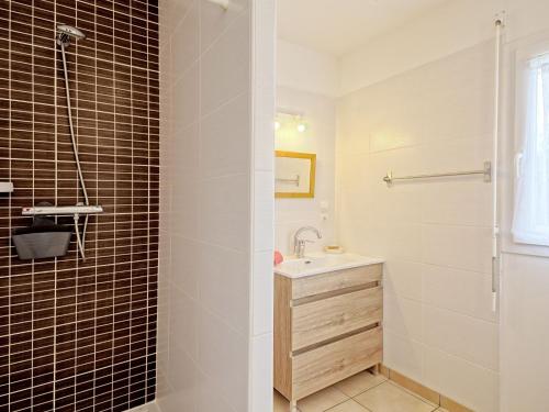 a bathroom with a sink and a shower at Holiday Home Chez Lucie by Interhome in Camlez