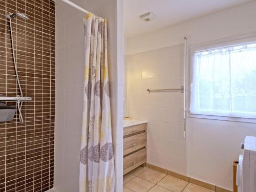 a bathroom with a shower with a shower curtain at Holiday Home Chez Lucie by Interhome in Camlez