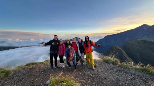a group of people standing on top of a mountain at Bunga Maliq Bungalow Lombok in Tetebatu