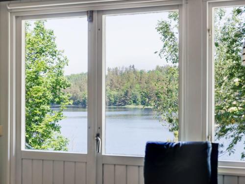a window with a view of a lake at Holiday Home Munkhalla Utsikten by Interhome in Asarum