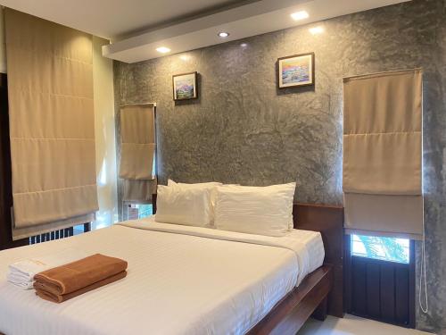 Postel nebo postele na pokoji v ubytování Sunset Beach Villas