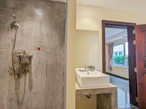a bathroom with a sink and a shower at Villa with Private Pool - by KohChangVillas in Ko Chang