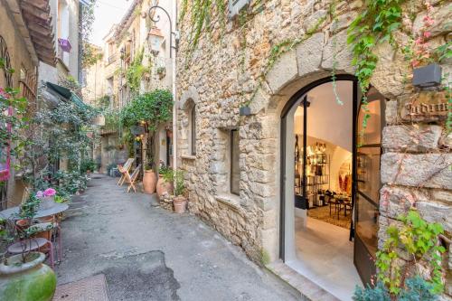 an alley in an old stone building with a store at Mougins Luxury Retreats in Mougins