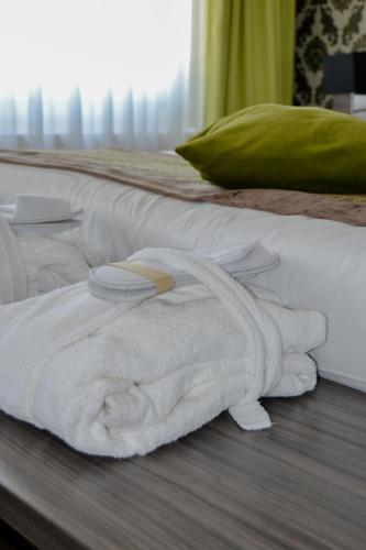 Ein Bett oder Betten in einem Zimmer der Unterkunft Parkhotel Valkenburg