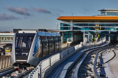a train on the tracks at a train station at Hampton by Hilton Luton Airport in Luton