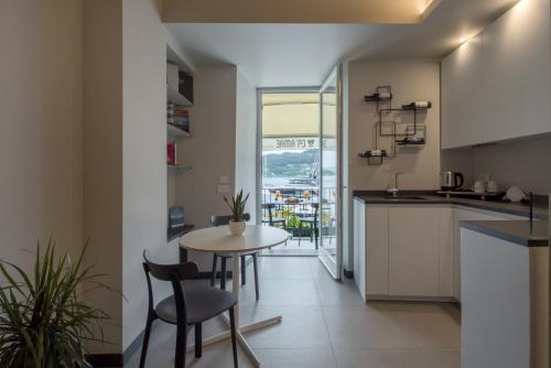 a kitchen and dining room with a table and chairs at Ca' Amae Portovener e in Portovenere