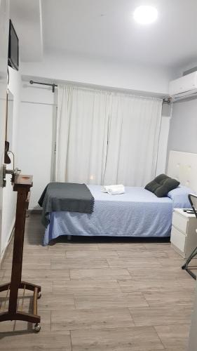 Postel nebo postele na pokoji v ubytování Guesthouse Central