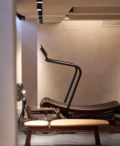 a room with a chair and benches in it at The Store in Oxford