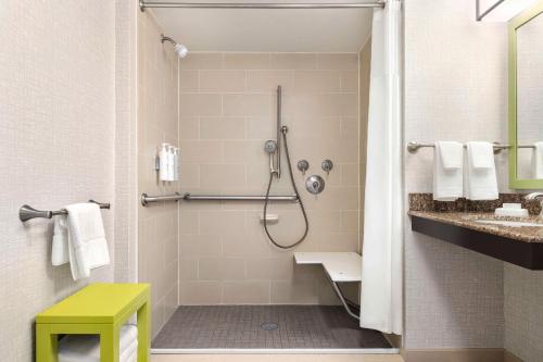 a bathroom with a shower and a sink at Hampton by Hilton Shelton in Shelton