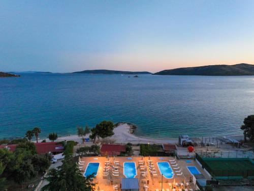 an aerial view of a beach and the water at Apartments Medena in Trogir