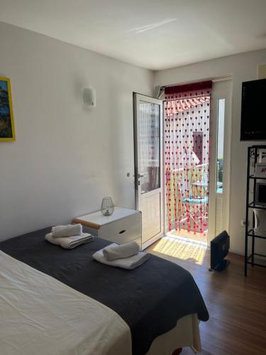 Ένα ή περισσότερα κρεβάτια σε δωμάτιο στο Delux Apartments Vele