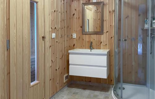 a bathroom with a sink and a shower at Cozy Home In Lillehammer With Sauna in Lillehammer